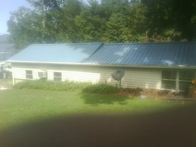 Blue metal roof running the length of a single story home in Lewiston